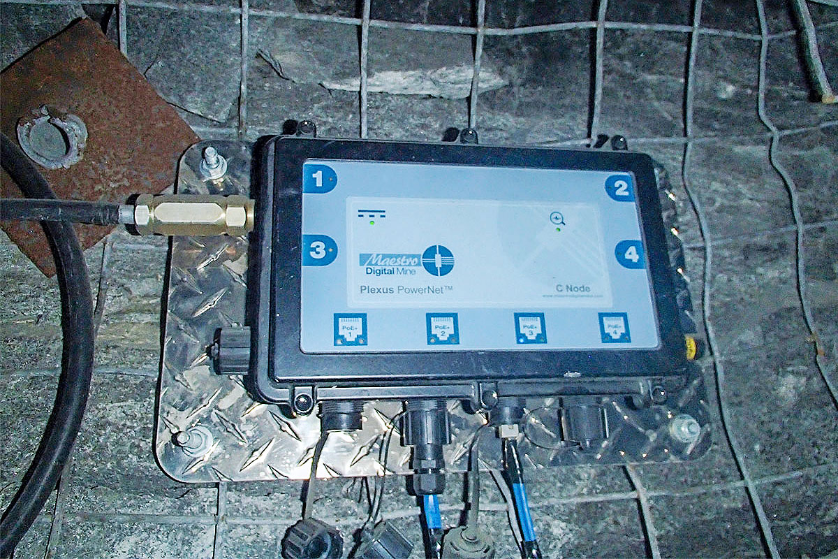 Image of a Plexus PowerNet unit mounted on the wall of a mine tunnel