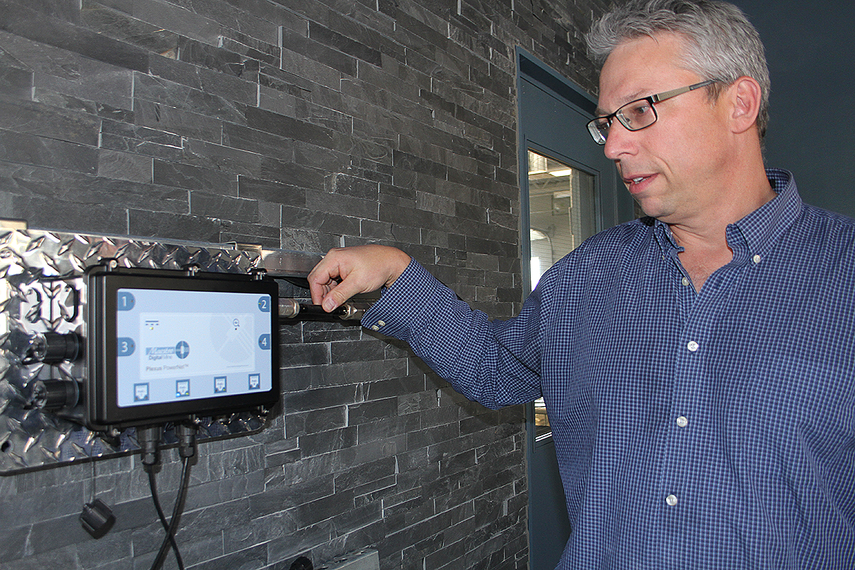 Image of David Ballantyne, vice-president of product development, with a Plexus Powernet, which is currently running a lighted sign in Maestro Digital Mine's office in Lively.